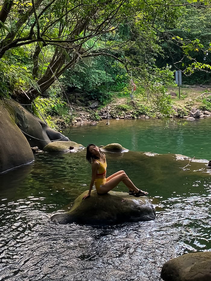 Gi Shieh, an east Asian woman wearing a yellow bikini set at Huiyao Waterfall near Taipei